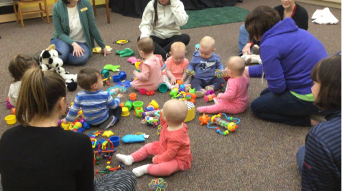 babies playing with toys