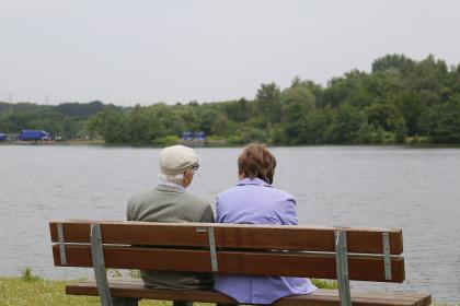 couple on a bench by the water