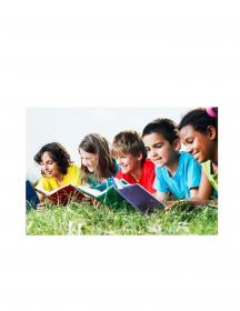 kids reading books together in the grass