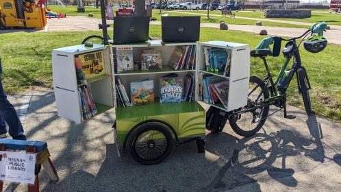 bicycle with a trailer full of books