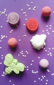 Bath Bombs of differing shapes and colors.