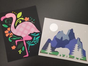 Paper craft flamingo silhouette and bear in mountains silhouette.