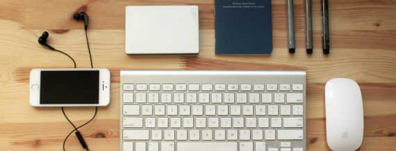 Image of laptop computer and smartphone on wood table.